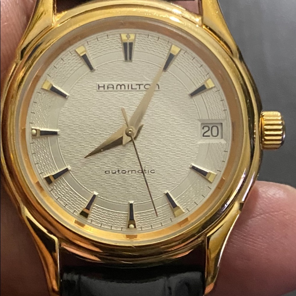 This is an automatic Swiss made watch. Unisex
